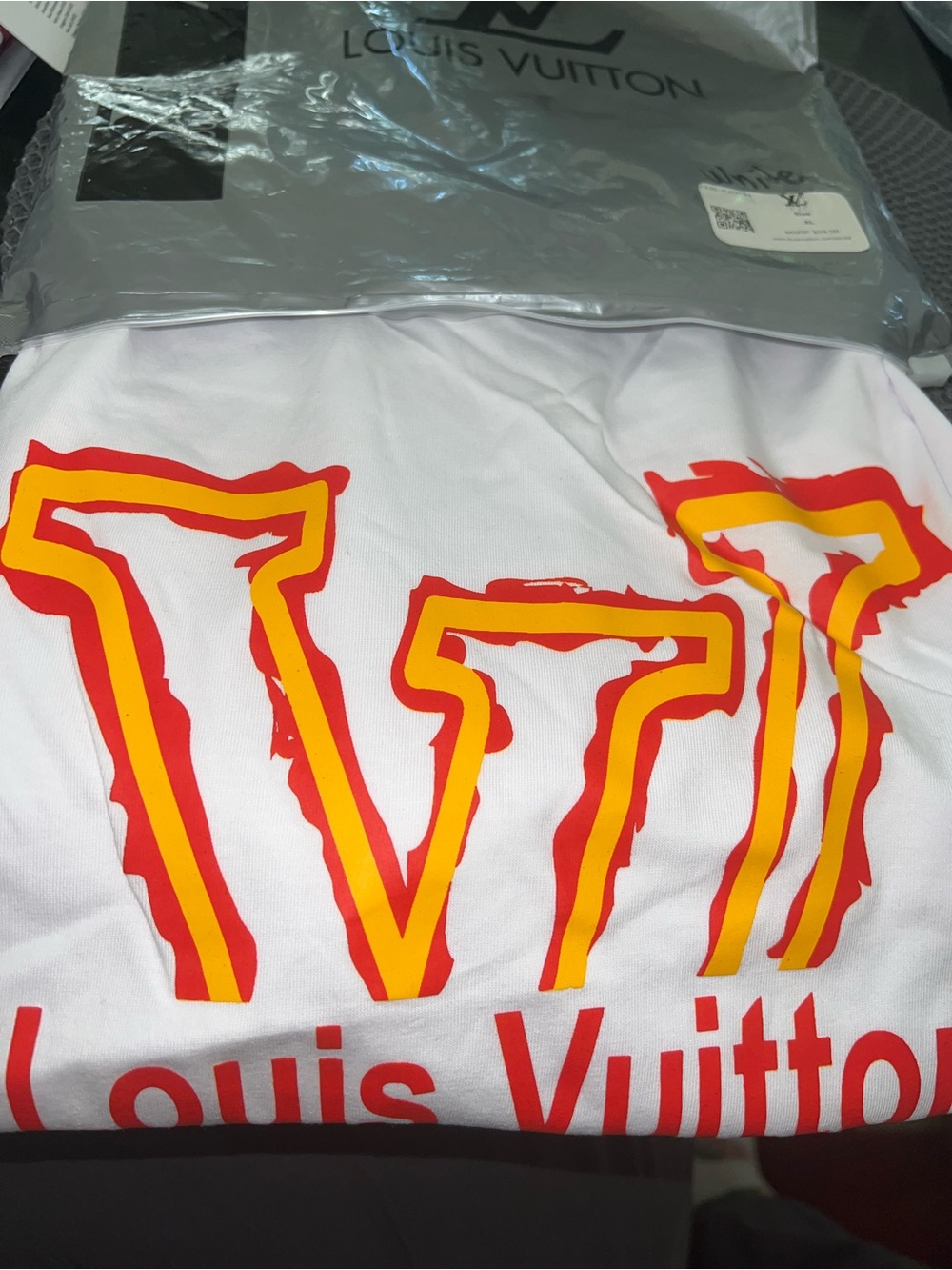 White, Yellow and Orange Logo Packaged Tee